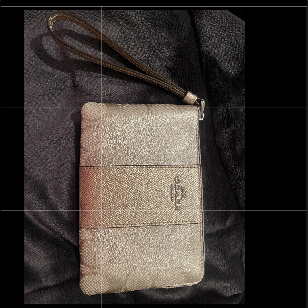 Brand new Coach wristlet gold